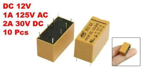 12V DC Coil DPDT 8 Pin PCB Power Relay Pack Of 10 HK19F, yellow, shown close-up and in hand for size reference.