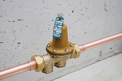 Watts LF25AUB-Z3 water pressure reducing valve with NPT female unions on copper pipe; brass body, polymer seat, 3/4 inch