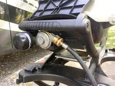 Propane Hose 1lb To 20lb Adapter For 12 Foot Connection attached to grill, showing safe flow and thermal protection, Weber Q compatible.