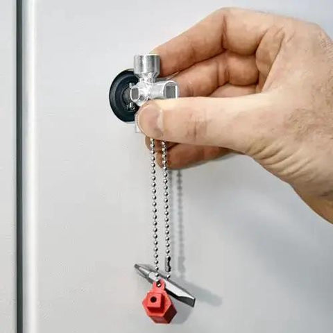 Hand using All-in-One Universal Control Cabinet Key for Gas, Water and Electric Shutoffs, includes 10 x 7 mm slotted bit, PH2 cross.