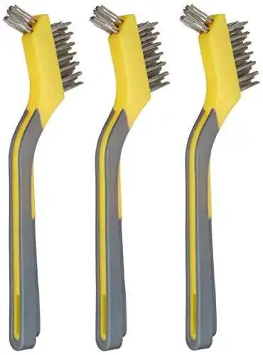 Three stainless steel mini wire brushes with soft grip ergonomic handles, grey and yellow, for paint removal and rust cleanup crevice cleaning.