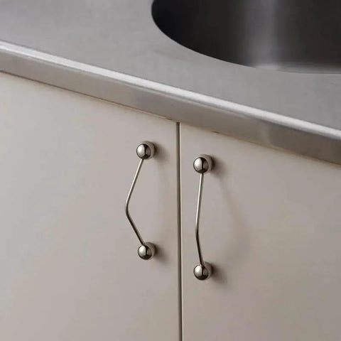 Kitchen cabinet installed with One Pack 5 Inch Titanium Silver Cabinet Handles Ball Tip Pulls With Polished Solid Brass Core And Premium Finish
