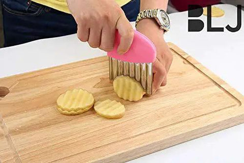 Person using Two Pack Crinkle Cutter Stainless Steel Wavy Blade Kitchen Knife Set For Veggies And Salads with ABS Handle.