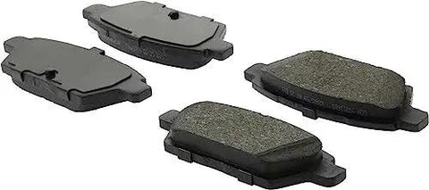 Centric C-Tek ceramic rear brake pad set for Nissan, four pads with grey friction material.