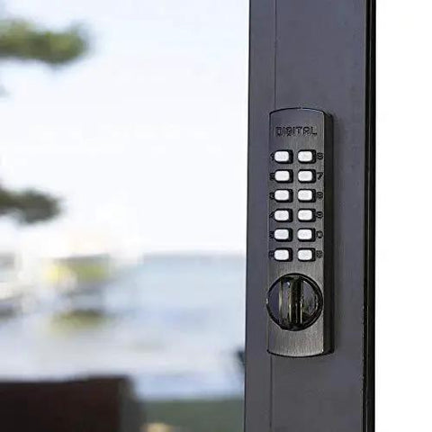 Keyless Surface Mount Hook-Bolt Lock For Sliding Doors In Antique Brass installed on a glass sliding door
