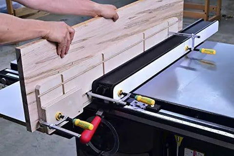 Matchfit Dovetail Clamps Set with Soft Grip Handles used to hold a wooden board on a table saw for precise routing.