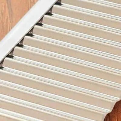 Close-up of Wavy Crinkle Cutting Tool for Veggies and Fruits with Serrator Blade Dope Salad Chopper Knife, stainless steel blade.