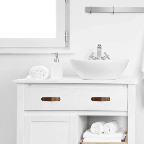 Vanity with Six Piece Leather Drawer Pulls Set In Brown With Gold Rivet Screws, 4.72 Inch Soft Cabinet Dresser Handles in a bathroom setting.