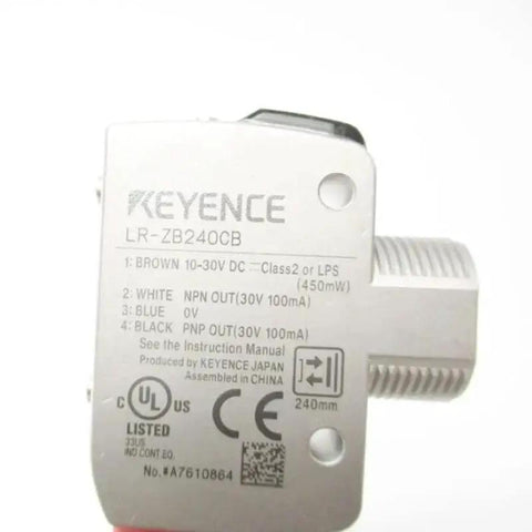 Close-up of LR-ZB240CB Laser Sensor showing technical specifications and multiple connection ports for industrial automation.