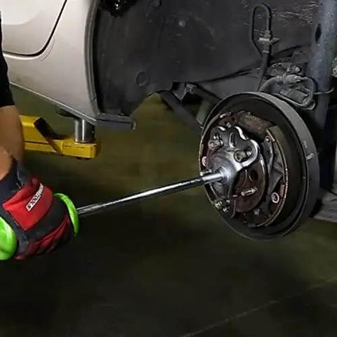 Slide Hammer Puller Set With Dent Puller CV Axle And Bearing Removal Tool Kit in use for automotive hub repair