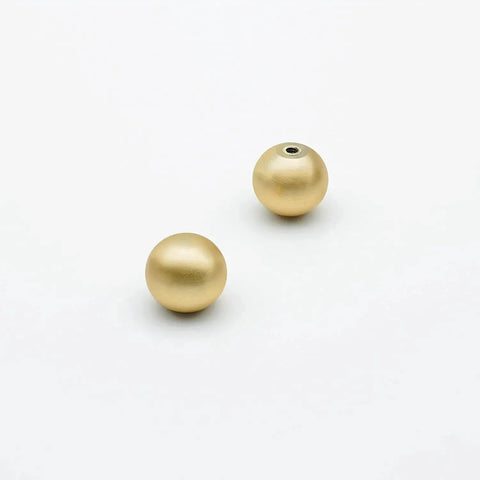 Two pieces of 10 Pack Brushed Gold Ball Cabinet Knobs 1 Inch Diameter Zinc Alloy Drawer Pulls, showing brushed gold finish.