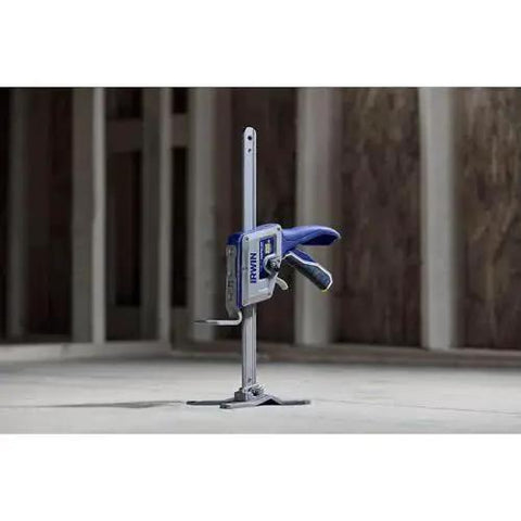 Quick Lift Construction Jack With 10 Inch Lift And 330 Lb Capacity, side view of compact metal jack in a construction site