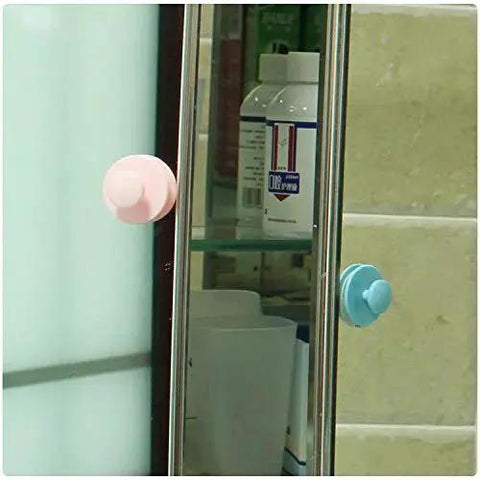 Self-Stick Drawer Knobs And Pull Handles Set 10 Pcs White Plastic ABS on glass cabinet door, pink and blue knobs visible
