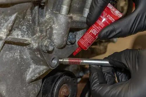 Applying High Strength Automotive Threadlocker Red For Metal Fasteners That Stand Up To Heavy Vibration And Oil Exposure With Bright Fluorescent
