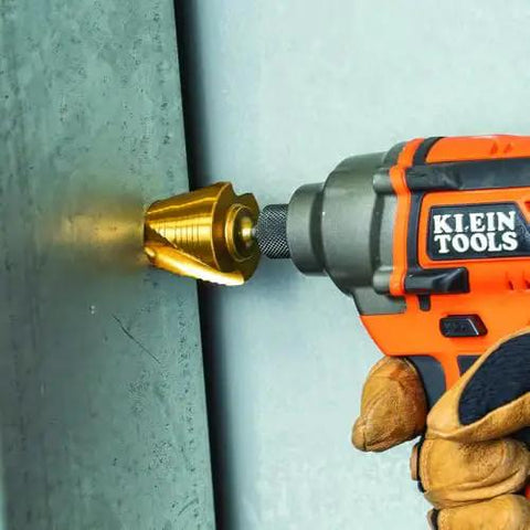 Drilling metal with Step Drill Bit Set For Thin Metal Plastic Aluminum And Wood Seven Eighths To One And Three Eighths Inch Double Spiral