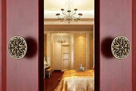 Close-up of 6 Piece Set Vintage Flower Drawer Pulls Knobs With Floral Embossing In Black Finish on wooden cabinet doors