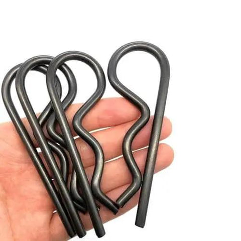 Close-up of black Heavy Duty Hitch Pin Set R Clip Hair Pins 10 Pack M4x90 Steel Cotter Pin Assortment in hand