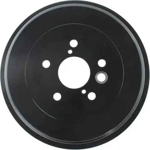 Front view of rear brake drum, black metal with bolt holes.