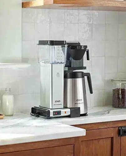 No Fuss 40 Ounce Coffee Brewer with Precise Temperature Control and a Quick 4 to 6 Minute Brew, polished silver, on kitchen counter