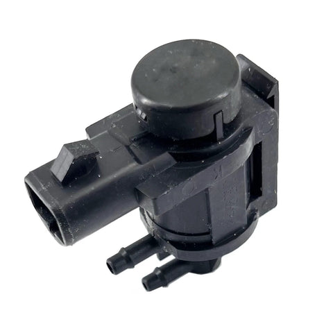 Black plastic hub lock actuator solenoid for 4x4 vehicles; round top, side 13mm connector, dual vacuum ports