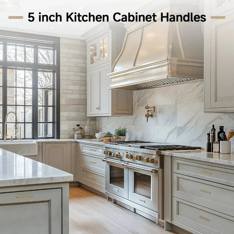 Modern kitchen with 30 Pack 5 Inch Champagne Bronze Cabinet Handles on light gray cabinets, featuring square gold pulls and zinc alloy construction.