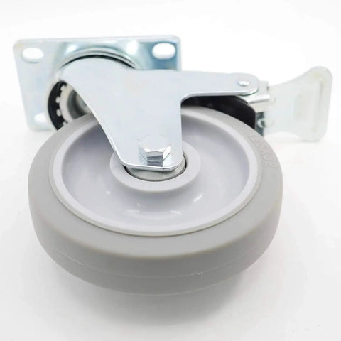 Close-up of a 5 inch swivel caster wheel with dual locking brakes in gray TPR rubber and metal housing, showing the top plate mounting.