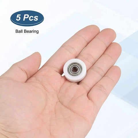 Hand holding 5x22x7 mm ball bearing; focuses on Five Pack 5x22x7 Mm 625ZZ Ball Bearing Guide Nylon Roller Bearings With Double Metal Shield.
