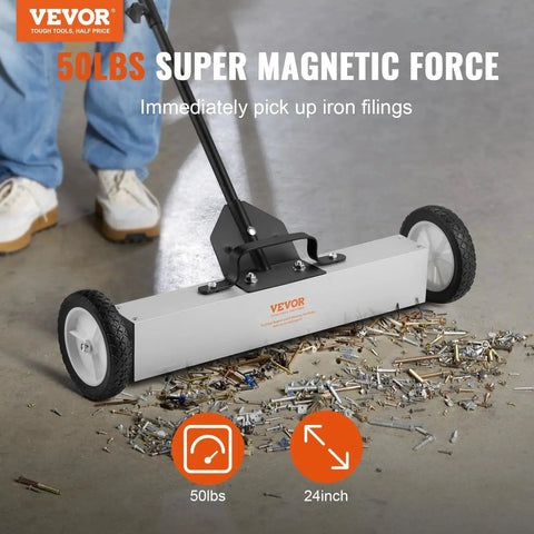 Effortless, heavy duty rolling magnetic sweeper with a 24 inch wide magnet and 50 lb pickup capacity shown picking up debris.