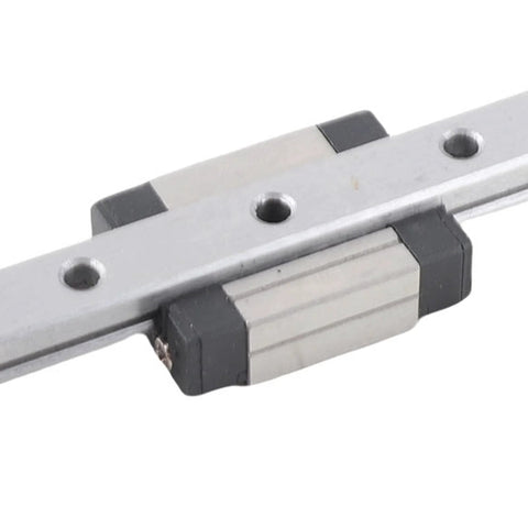 100mm linear rail guide with sliding rail block, silver rail and black end caps, close-up view