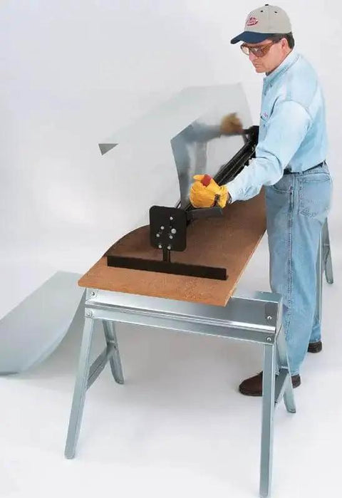 Worker using Portable Mini Metal Brake 48 Inch 22 Gauge Capacity Bends Up To 135 Degrees for bending roof flashing on job site