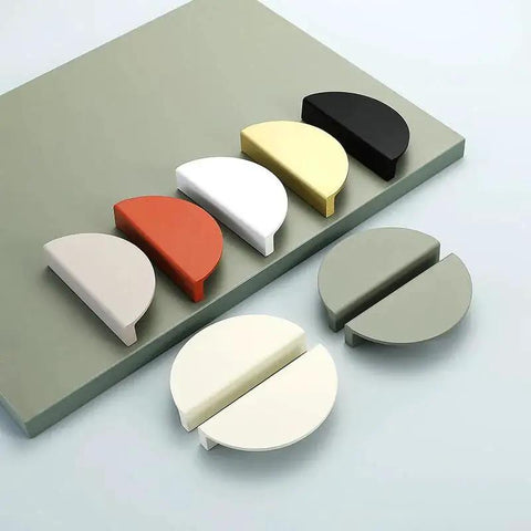 Colorful half-moon drawer pulls displayed on a board, including Green Half Moon Drawer Pulls 2.5 Inch Four Pieces With Screws Semicircle Cabinet Handles.