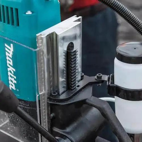 Close-up of Portable Magnetic Drill For Steel With One And Three Eighths Inch Capacity And Two Inch Thick Cutting, showing spindle and coolant system.
