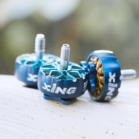 XING2 2207 FPV Brushless Motors 1855KV 6S Four Pack with high torque for FPV racing drones, durable blue casing.