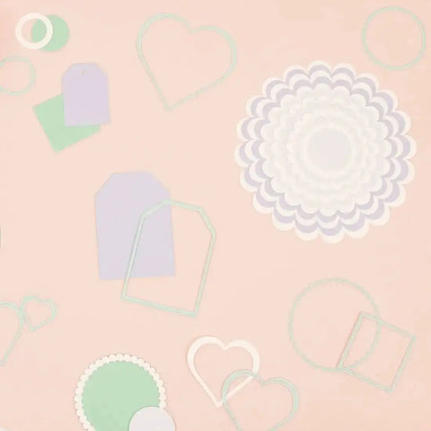 Mini Die Set For Scrapbooking And Card Making - 7 Scalloped Circle Dies, various cut shapes for DIY decorations on a peach surface.