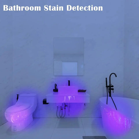 Bathroom with UV lighting showing stain detection on toilet, sink, and bathtub highlighting high power compact UV flashlight use.