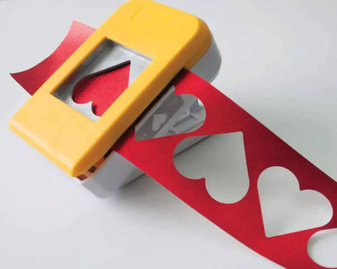 SlimLock Large Oval Punch 40mm By 30mm for Scrapbooking and Card Making cutting red paper hearts with upside-down alignment
