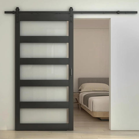 Front view of 48 Inch By 84 Inch 5 Lite Tempered Frosted Glass Sliding Barn Door With Black Finish Composite Interior Hardware Kit And Rail System Left Or Right Mount Easy Assembly Dope Modern Farmhouse Vibe installed in bedroom.