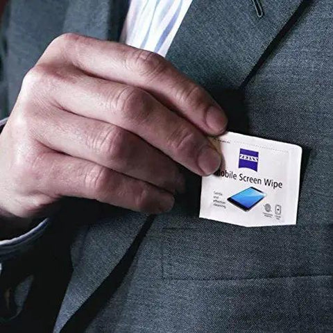 Person placing ZEISS Pre-Moistened Screen Wipes For Phones, Tablets And Laptops, 120 Count in suit pocket.