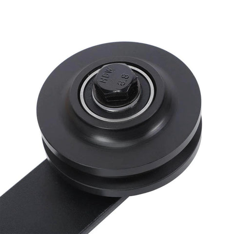 Close-up of a black wheel from the Carbon Steel Sliding Door Track Rail Pulley Wheel Roller Set 2 Pack for Kitchen Bedroom Wardrobe