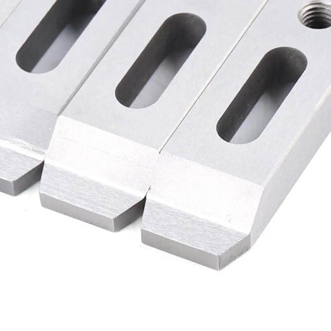Close-up of Set Of 4 Magnetic Jig Clamps For Wire EDM Fixture Boards In Stainless Steel With M8 By 1.25 Screws, showing pads