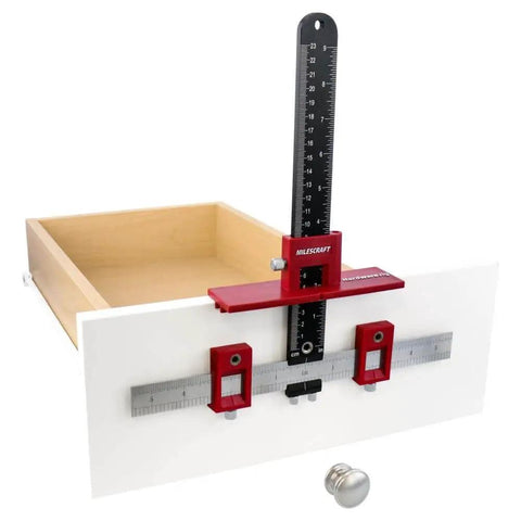 Adjustable Drill Guide Hardware Jig For Cabinet Handles Knobs And Drawer Pulls Installations With Repeat Drilling Reversible Left To Right Transfer Sliding Stops And 5mm Bushings For Fast No Brainer Setup shown installed on a drawer front.