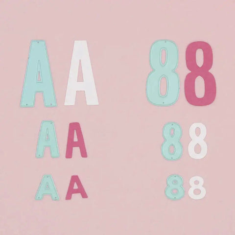 Number Shaped Die Cut Set, 0 Through 9, For Card Making And Scrapbooking, shown with letters and numbers on pink background