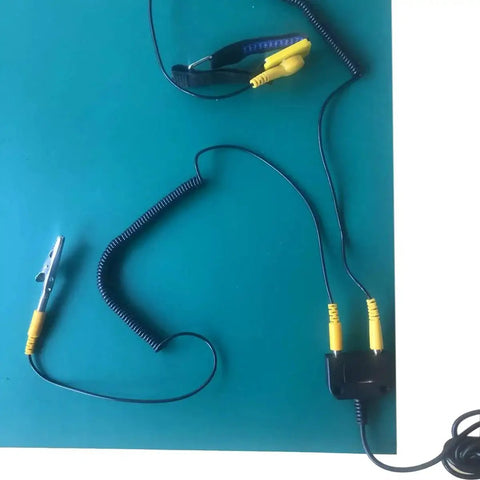 Essential ESD Grounding Kit for Workbench Table Mat and Wrist Straps with Dual 4mm Copper Ground Cords on a mat.