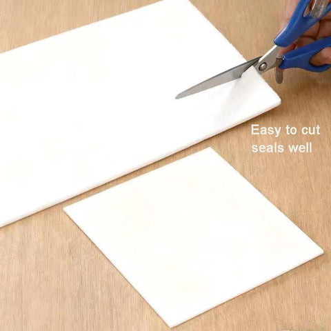 Ceramic fiber gasket paper sheets, 8x12 in, 1/4 in thick, white; two sheets on wood with blue-handled scissors.