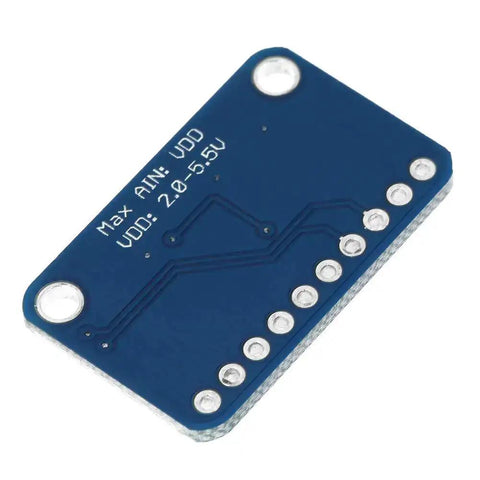 Back view of 16-Bit I2C ADC Development Board For Microcontrollers, showing soldered pins and blue circuit board design.
