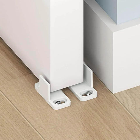 Barn Door Floor Guide for Smooth Sliding Doors, bottom guide floor mounted closet door hardware with screws, visible on wooden floor.