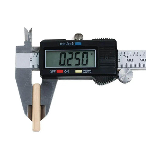 One Quarter Inch By One And A Half Inch Hardwood Dowel Pins, digital caliper measuring 0.250 inches, close-up