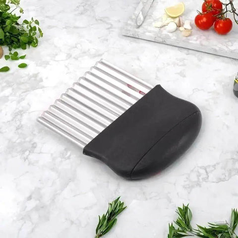 Crinkle Cutter Stainless Steel Potato Cutter and Veggie Slicer, black handle, wave design, on kitchen counter, 9.5x14 cm.