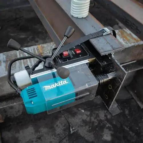 Portable Magnetic Drill For Steel With One And Three Eighths Inch Capacity And Two Inch Thick Cutting, A Real Workhorse With 850 RPM From A Ten Amp Motor, Lightweight And Compact For Tight Spaces, Removable Guard, Spindle Coolant System Makita HB350 attached to steel beam