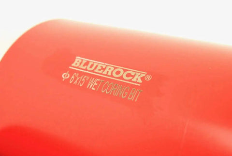Close-up of a 6x15 inch red Bluerock wet coring bit surface, part of the 1 To 6 Inch Diamond Wet Core Drill Bit Set With One Quarter Inch Threaded Shank For Concrete Rebar Asphalt Brick Rock And Masonry Hole Cutting And Barrel Coring Bits.